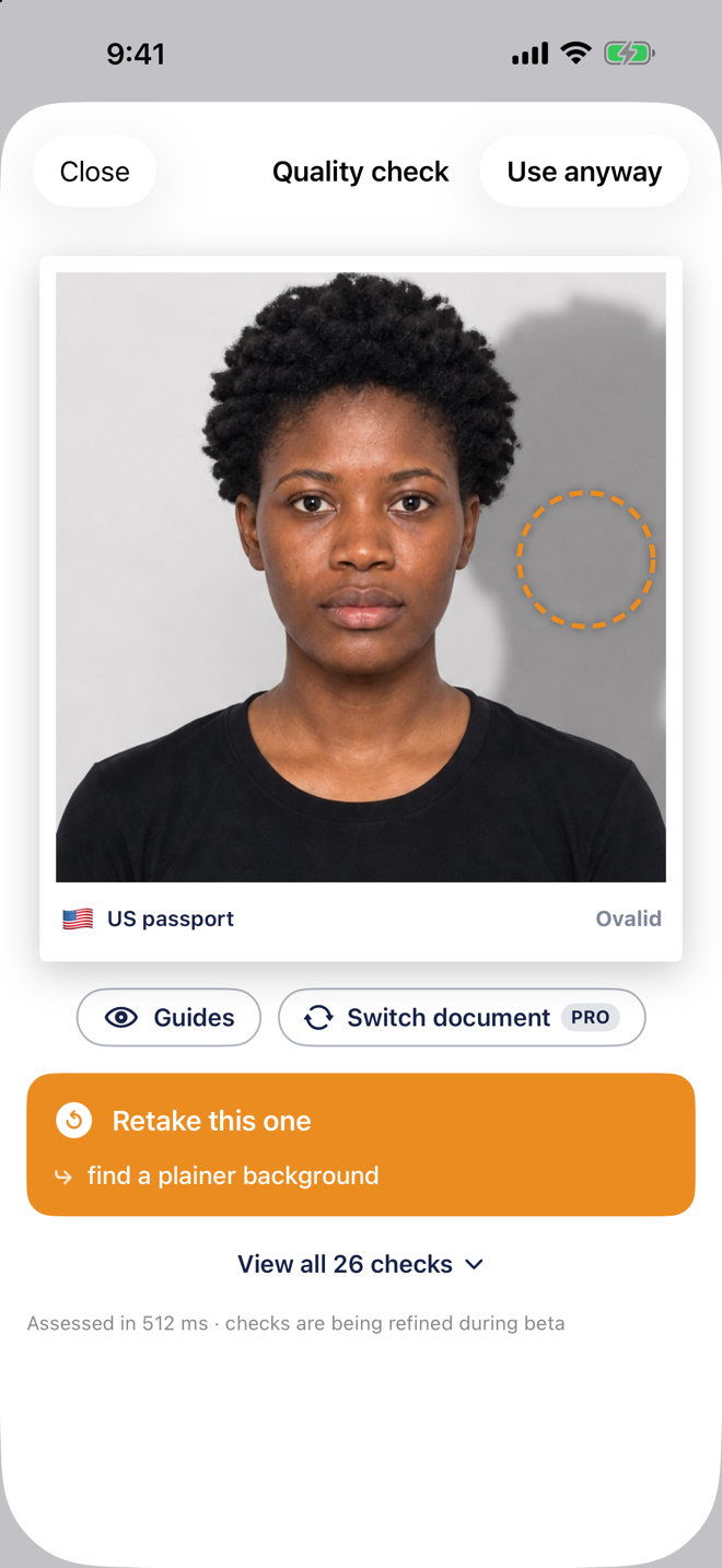 Ovalid verdict screen flagging a background shadow, with the problem area circled and advice to retake